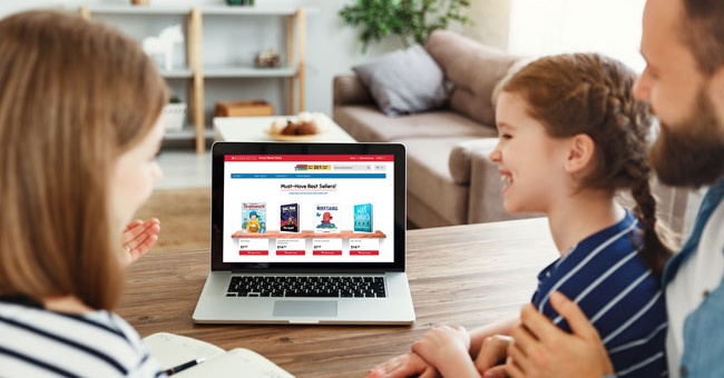 Family shopping Virtual Fairs on a laptop.